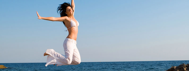 girl jumping on beach